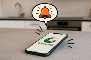Téléphone avec comme fond d'écran le logo Greenshelf et recevant une notification - Application Greenshelf